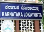 Two traffic cops caught red handed by Lokayukta officials accepting bribe of Rs.3,000 from a man for an official favour in Mandya