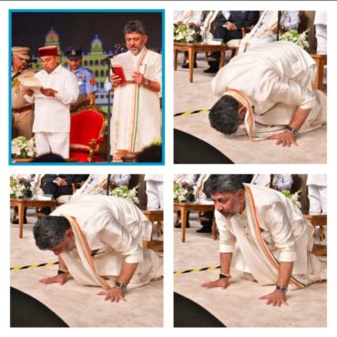 Chief Minister D K Shivakumar bows to the people of the state from the swearing-in stage